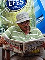 Man Reading Newspaper - Northern Nicosia - Turkish Republic of Northern Cyprus (28367075292).jpg