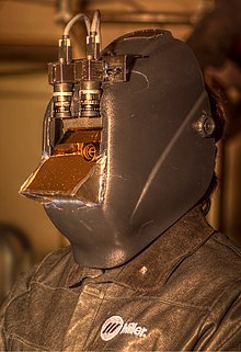 The MannGlas "Digital Eye Glass" welding helmet uses cameras and high-dynamic-range imaging to augment the user's view in dark areas and diminish it in bright areas. MannGlass welding helmet.jpg