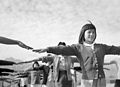 Female internees practicing calisthenics at Manzanar internment camp, 1943
