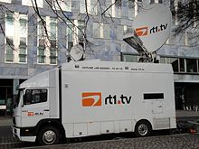 Mercedes-Benz 1320 satellite broadcast van from rt1.tv production GmbH with a parabolic antenna with a diameter of 2.4 meters on the roof.