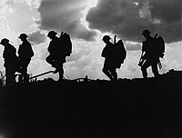 British soldiers going up to the front line during the Battle of Broodseinde. Photo by Ernest Brooks. NLS Haig - Troops moving up at eventide - men of a Yorkshire regiment on the march (cropped).jpg