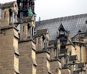 The massive buttresses which counter the outward thrust from the rib vaults of the nave.