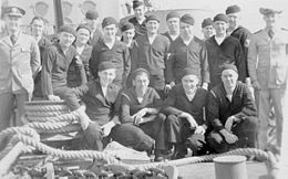Part of the crew of USS PCE 881, which patrolled the coast of Alaska during World War II. PCE 881 Crew and JPM Alaska.jpg