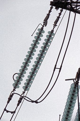 A high voltage insulator in the UK. Arcing horns are also in place.