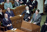 President Ronald Reagan speaking at podium while addressing members of the House of Commons during trip to Canada.jpg