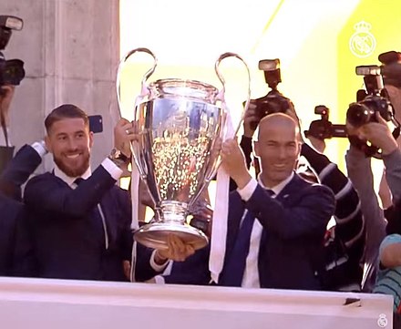 Zidane (right) with Real Madrid captain Sergio Ramos lifting the 2016 UEFA Champions League trophy