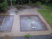 Hatches in Minuteman Bikeway for Arlington extension of the Red Line