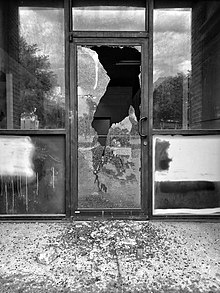 Broken windows of a shop in Omaha, Nebraska Shattered (49960356636).jpg