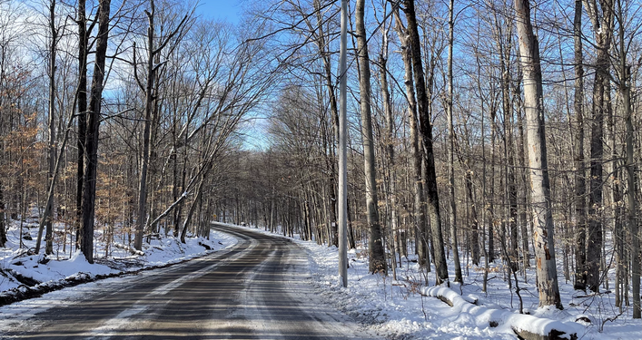 Photo of a snowy road near Lake Joseph, Muskoka