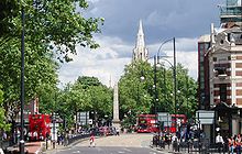 Stratford town centre with Stratford Broadway, the Gurney Memorial and the spire of St John's Church