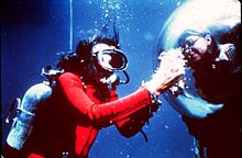 Earle displays samples to an aquanaut inside the Tektite habitat, 1970 Sylvia Earle-nur08002.jpg