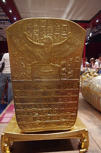 Isis with her wings spread on the footend of the outer coffin of Tutankhamun.