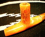 Uncompahgre Ute Salmon alabaster ceremonial pipe. Ute pipe styles are similar to those of the Plains Indians, with notable differences. Ute pipes are thicker and use shorter pipestems than the plains style and more closely resemble the pipe styles of their Northern neighbors, the Shoshone. UtePipe3.jpg