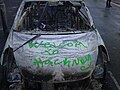 Burnt-out and vandalised car in Hackney