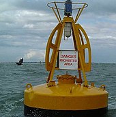 Warning buoy marking the wreck of SS Richard Montgomery (masts visible to left) Wreck of the Richard Montgomery (to left of buoy) - geograph.org.uk - 19013.jpg