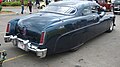 Custom Merc with pinstriping, skirts, '81 Lincoln taillights, and Appletons