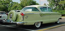 1956 Nash four-door sedan with factory color-matched Continental tire mount 1956 Nash Ambassador sedan rear.jpg