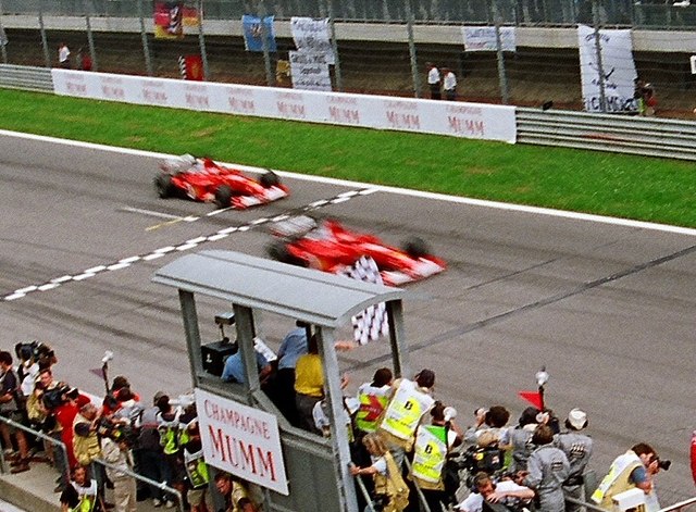 The controversial Ferrari 1–2 crossing the finish line in 2002.