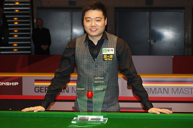 Ding with the 2014 German Masters trophy