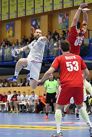 Men's handball Austria Czechia 2018-01-05, picture shows Pavel Horák (CZE), Mykola Bilyk (AUT), Romas Kirveliavicius (AUT)