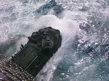 Amphibious Assault Vehicles from 2nd Assault Amphibian Battalion splash off the back of an amphibious assault ship off the coast of Camp Lejeune, NC in 2009. AAVs off Campl Lejuene.jpg