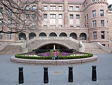 The old Romanesque Revival-style 77th Street entrance AMNH S flowerbed jeh.jpg