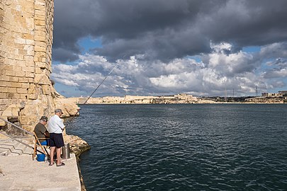 A couple of men angling in Valletta, Malta