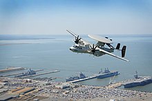 E-2D Hawkeye An E-2D Hawkeye flies over Naval Base Norfolk (13315193084).jpg