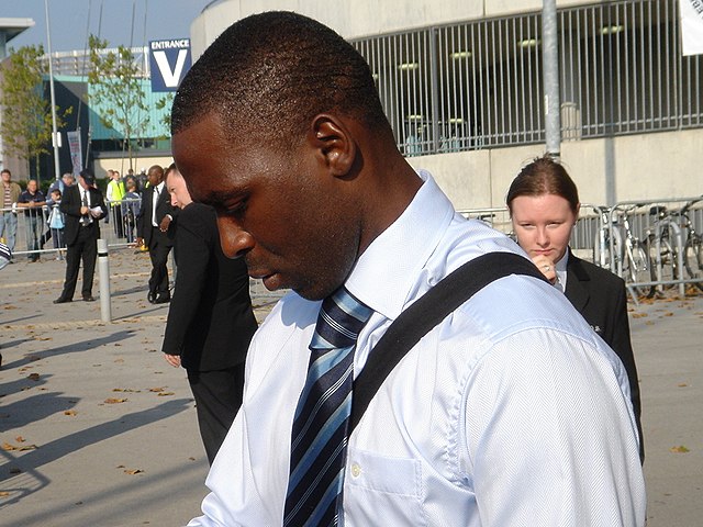 Cole signing autographs outside the City of Manchester Stadium in October 2005