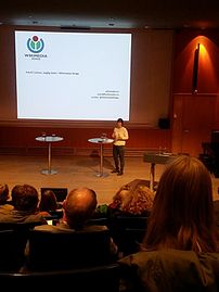 Astrid Carlsen (WMNO) speaking at a conference hosted by The Research Council of Norway
