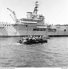 Australian soldiers being ferried in a small craft, from troop transport HMAS Sydney on its arrival in North Borneo (Sabah) to counter Indonesian confrontation and possible attacks by Filipino pirates as part of their defence aid program to Malaysia in 1964. Australian soldiers ferried in small craft to guard Sabah (AWM NAVY05185).JPG