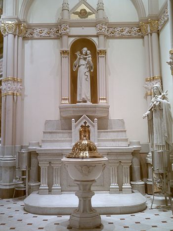The Baptismal font in front of the St. Joseph's altar at St. Michael's Church Baptismal Font at St. Michael's Philadelphia.jpg