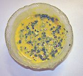 Sauce béarnaise or Béarnaise sauce made of clarified butter and egg yolks flavored with tarragon shallots and chervil.