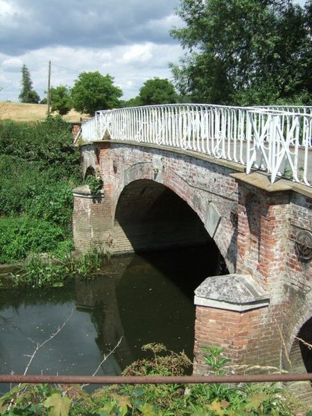 Grade II* listed Weir Bridge over the River Mole built in 1840.