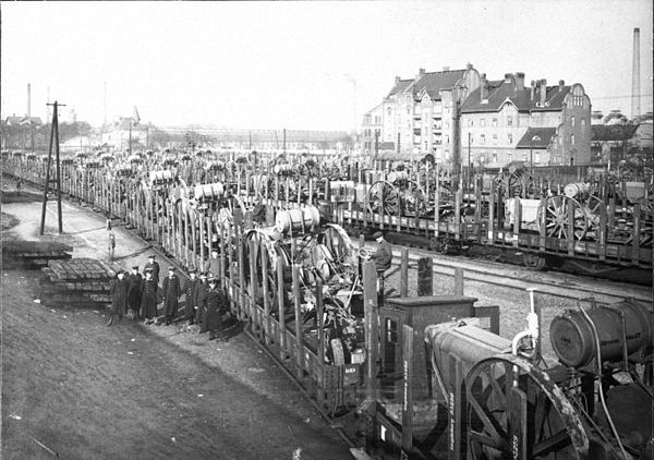 Trains loaded with machinery deliver their cargo in 1920 as reparation payment in kind.