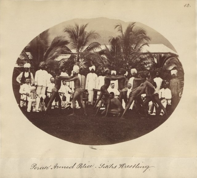 Trained Sikhs in the Perak Armed Police demonstrating Pehlwani wrestling, c. 1880–1890.