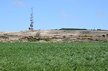 The telecommunications mast on Carnmenellis hill; the mound to the right is a covered reservoir according to the OS map Carnmenellis Down.jpg