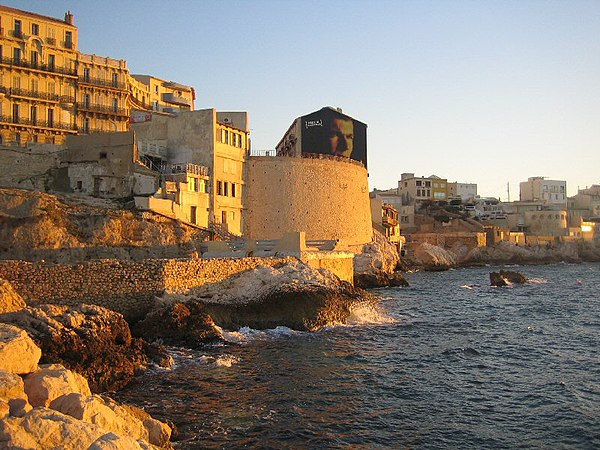 La Corniche, seaside roadway along the coast of Marseille, with a mural of Zidane on the wall