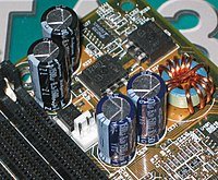 Five Rubycon capacitors on a motherboard