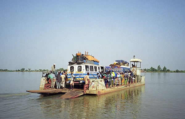 Passenger vehicles on the Bani River ferry near Djenné.