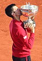 Image 33Novak Djokovic, the 2023 men's singles champion. It was his record-breaking twenty-third major title and his third at the French Open. (from French Open)