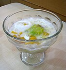 Es teler, an Indonesian dessert made from shaved ice, condensed milk, coconut, avocado, and jackfruit.