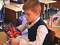 * Nomination A first grader reads a certificate that he has read the ABC book. Russia, 2021 --AKA MBG 11:28, 3 May 2021 (UTC) * Decline  Oppose Unfortunately, the head and the certificate are cropped in --MB-one 10:47, 8 May 2021 (UTC)