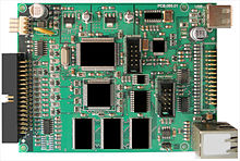 A floppy hardware emulator, same size as a 3 1/2 -inch drive, provides a USB interface to the user. Floppy hardware emulator.jpg