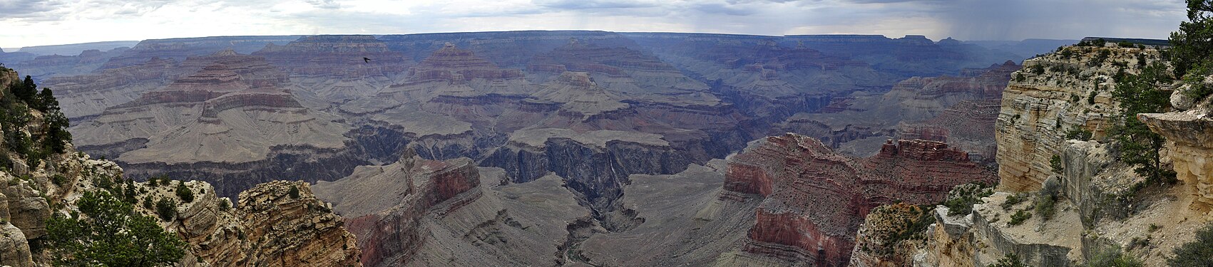 South rim of the Grand Canyon with rain in the distance