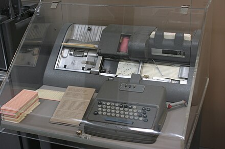 IBM 026 Printing Card Punch. Note pink program card mounted on the program drum (top center).