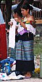 Indigenous woman selling textiles at Palenque, Chiapas, Mexico