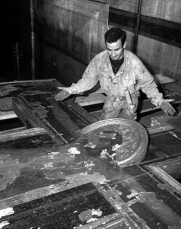 Cimabue's Crucifix after it was near destroyed in the 1966 Flood of the Arno, before the 10 year restoration Ivo Bazzechi Cimabue Flood.jpg