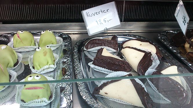 Some 'Kuverter' cakes on display at a bakery in Denmark. The image holds more information and there is a category on 'Kuverter (cake)' with more pictures and info as well.