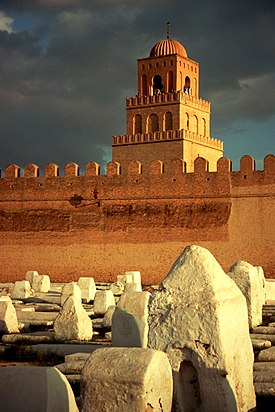 Mosque of Uqba, or the Great Mosque of Kairouan, commenced by Uqba ibn Nafi circa 670. Kairouan-mosquee-cimetiere.jpg
